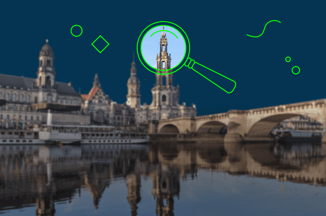 Dresden als Hintergrundbild. Mit einer Lupe wird ein Teil des Bildes herangezoomt.